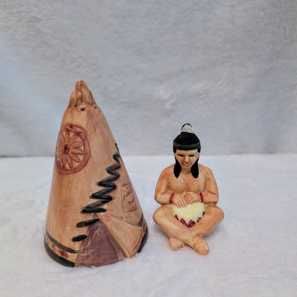 Vintage salt and pepper shaker. Indigenous person and teepee.